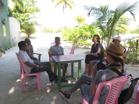 Hydrous team speaking to a council member on Bodufolhudhoo.