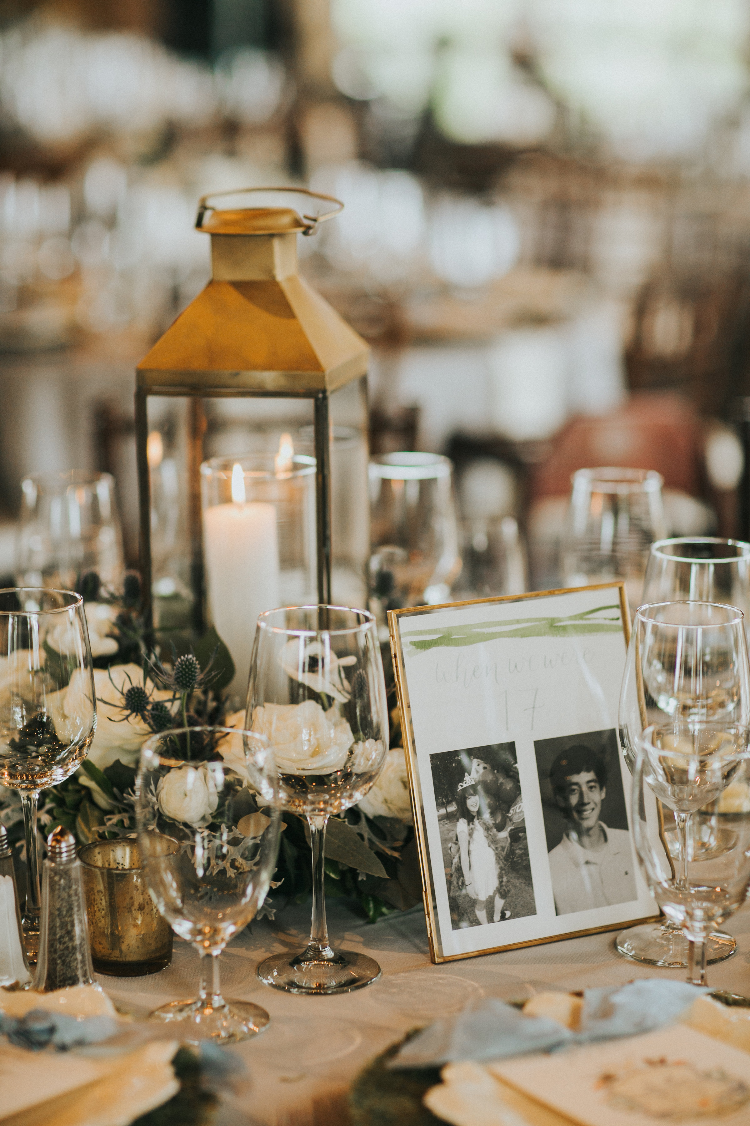 Every other table had a lantern with a floral wreath to bring more candlelit ambiance into the space. Table numbers made by Grace Art Market showcased photos of us from ages 1 to 20.