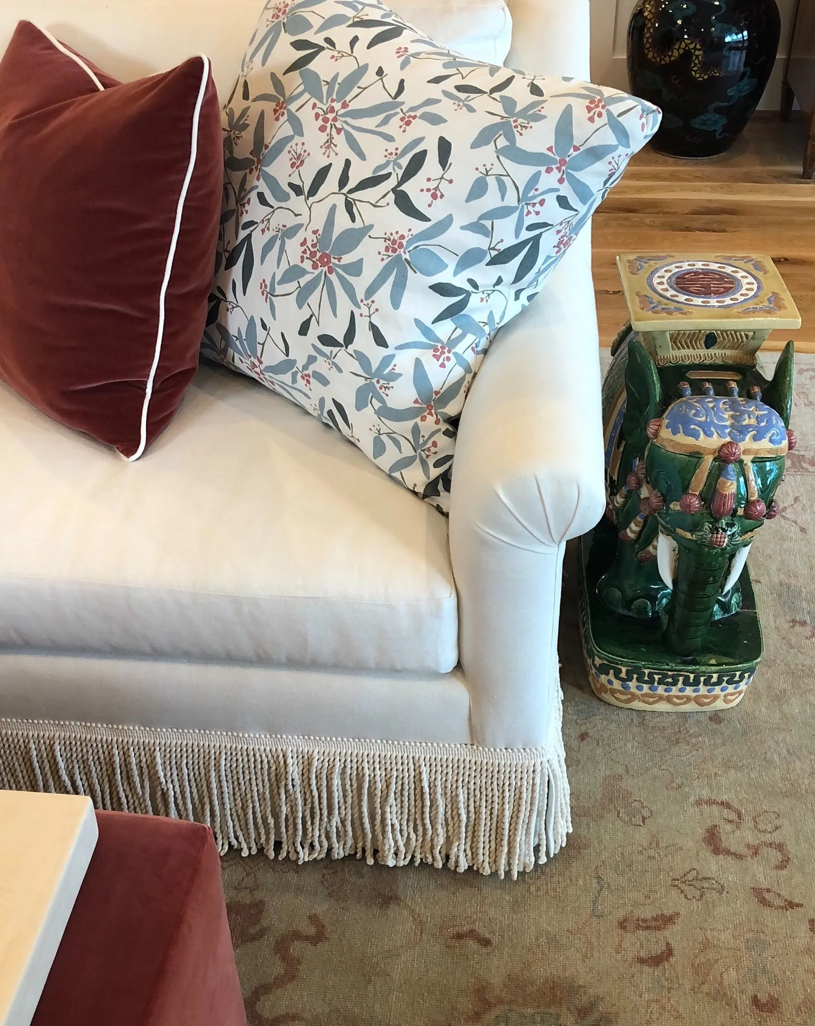 In the main living room, Lindsey added a formal touch with bullion fringe around the sofa.