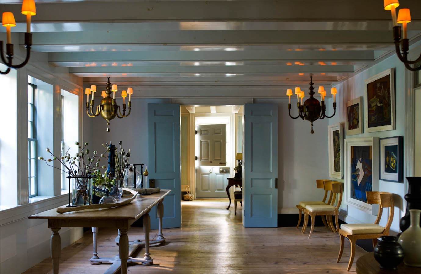 I might see ONE of those chandeliers and think — that’s a showstopper. Let’s put it over the dining room table, a very special moment. Steven? Let’s do FOUR and put them in this enormous walk-through space! Love the way you think, Steven.