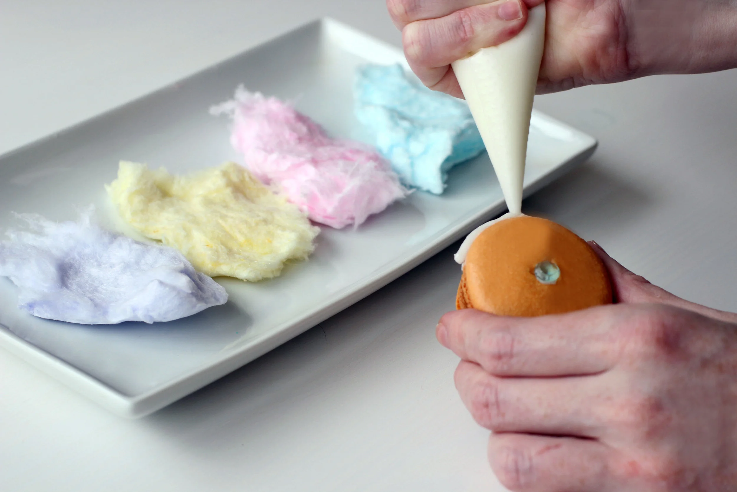 Step 3: Adhere troll hair to macaron.