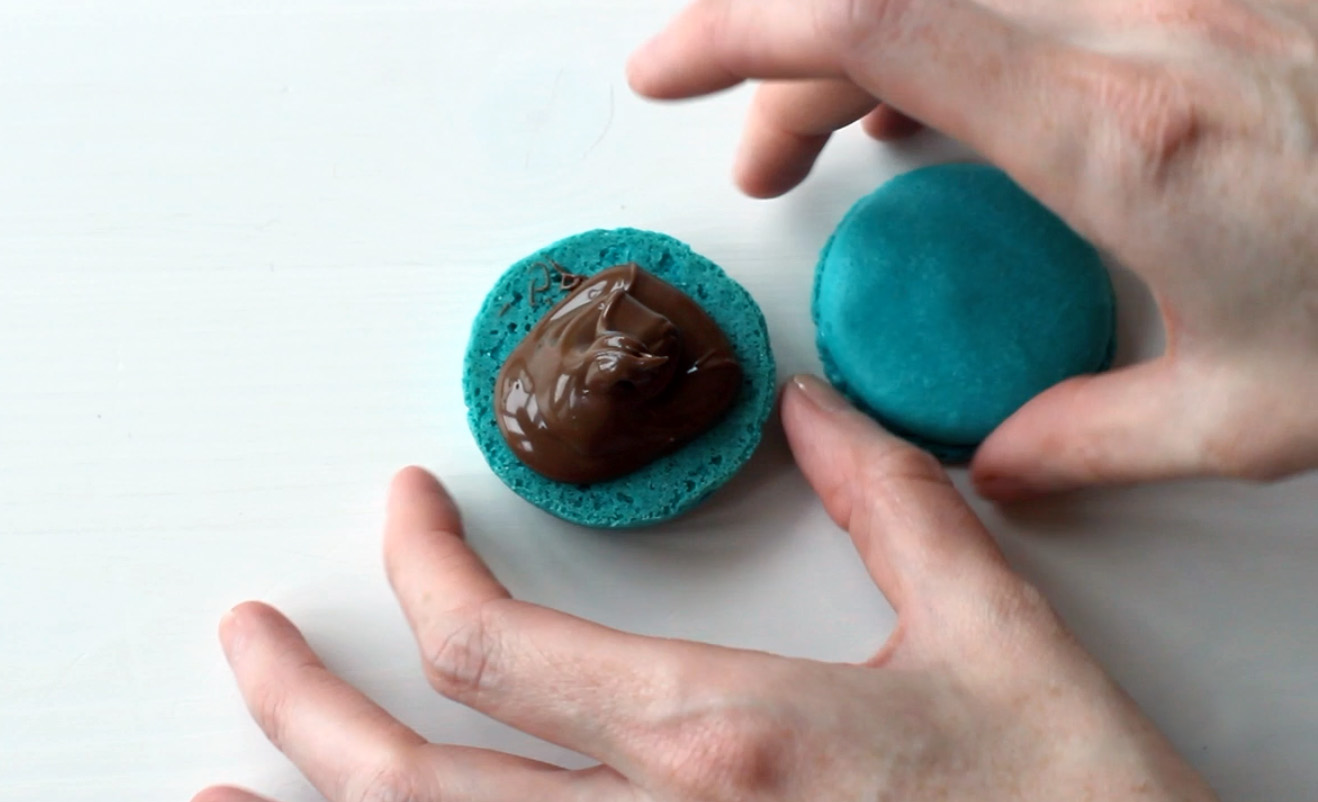Step 1: Fill macaron with chocolate ganache.