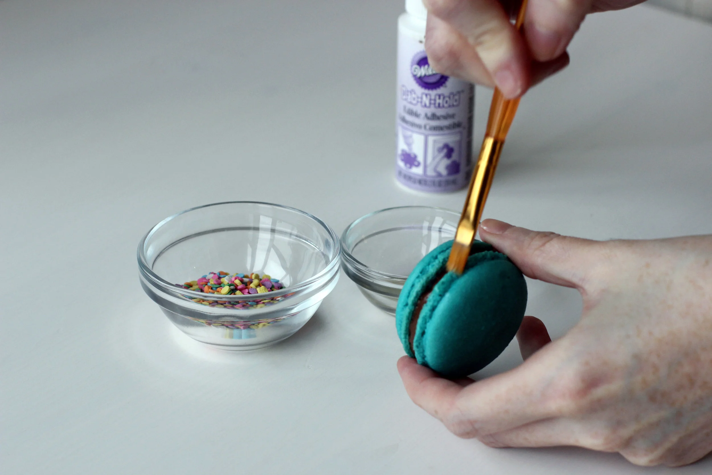 Step 2: Glue sprinkles onto side of macaron.