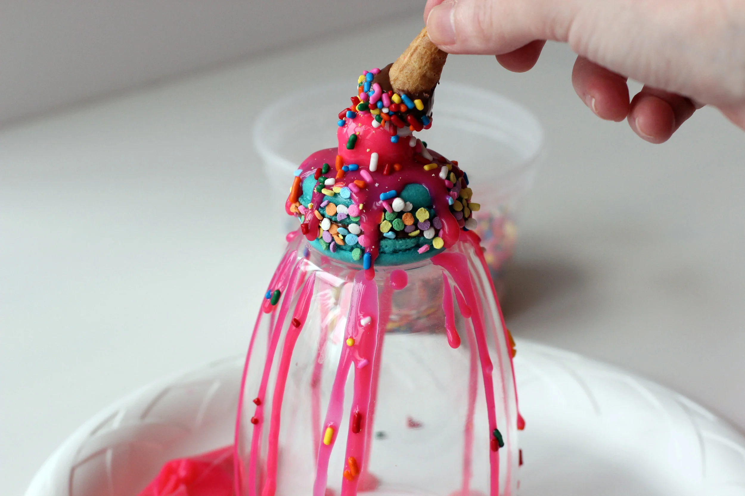 Step 8: Adhere cone to fondant cherry.