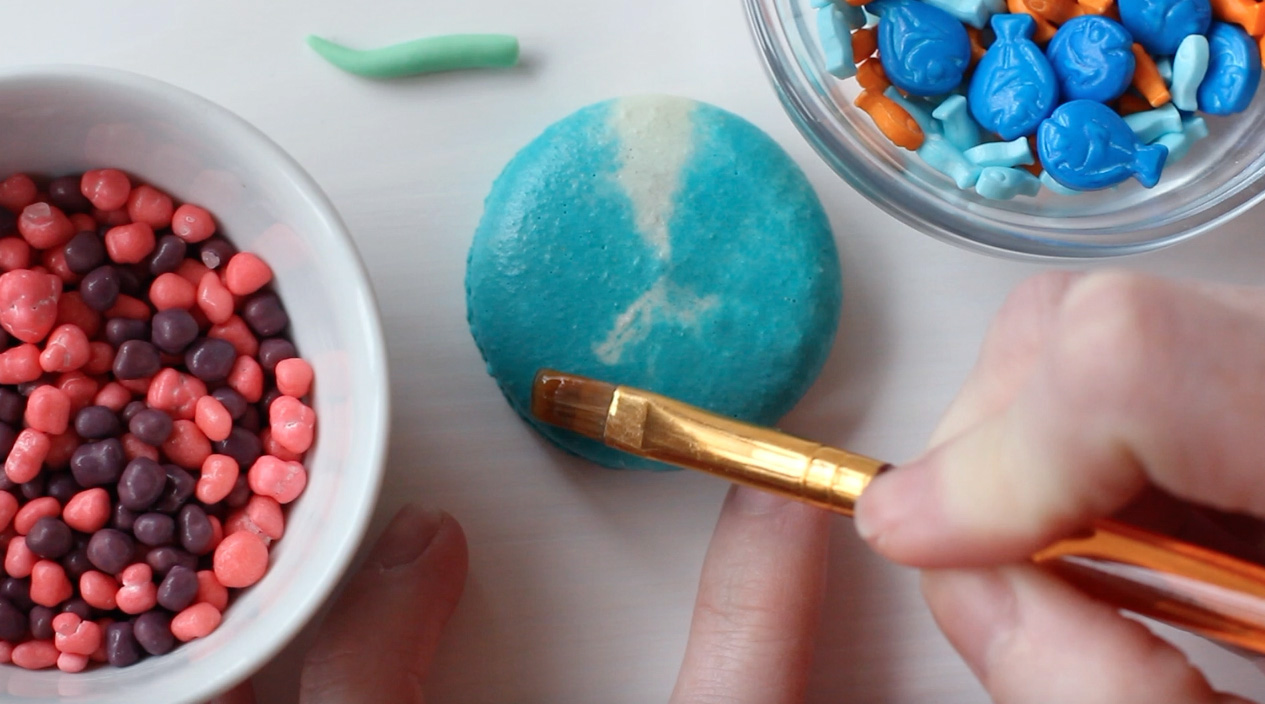 Step 2: Brush the bottom of macaron with edible glue.