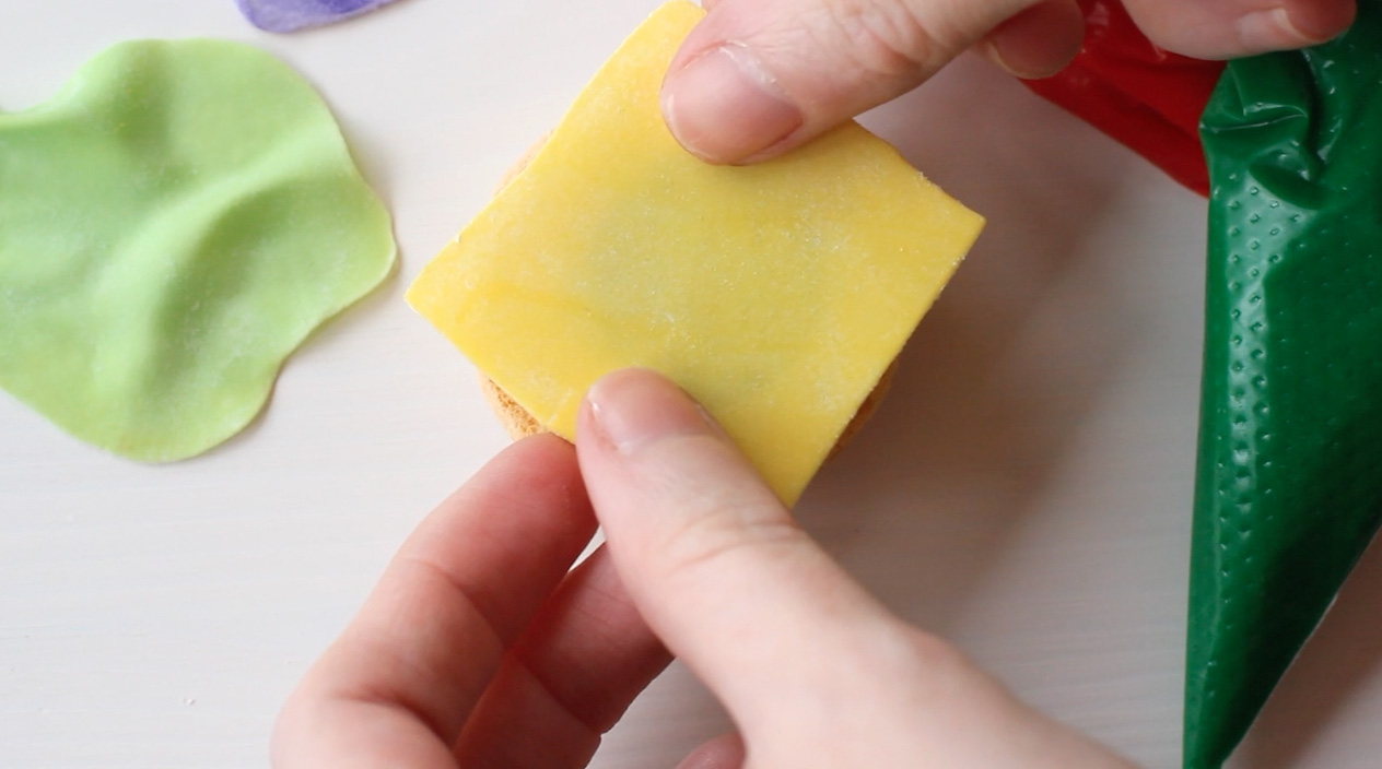 Step 3: Layer macaron with "cheese" slice.