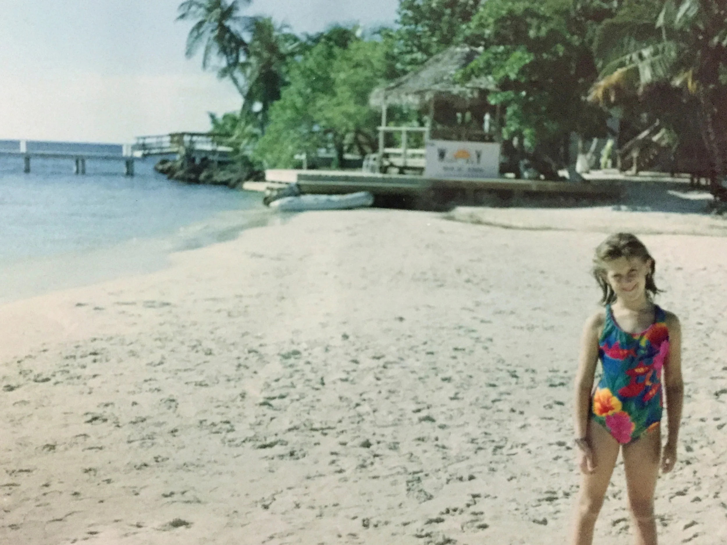 We moved to Honduras when I was 5yrs old. I am pictured above standing on the beach in West End on the island of Roatán.