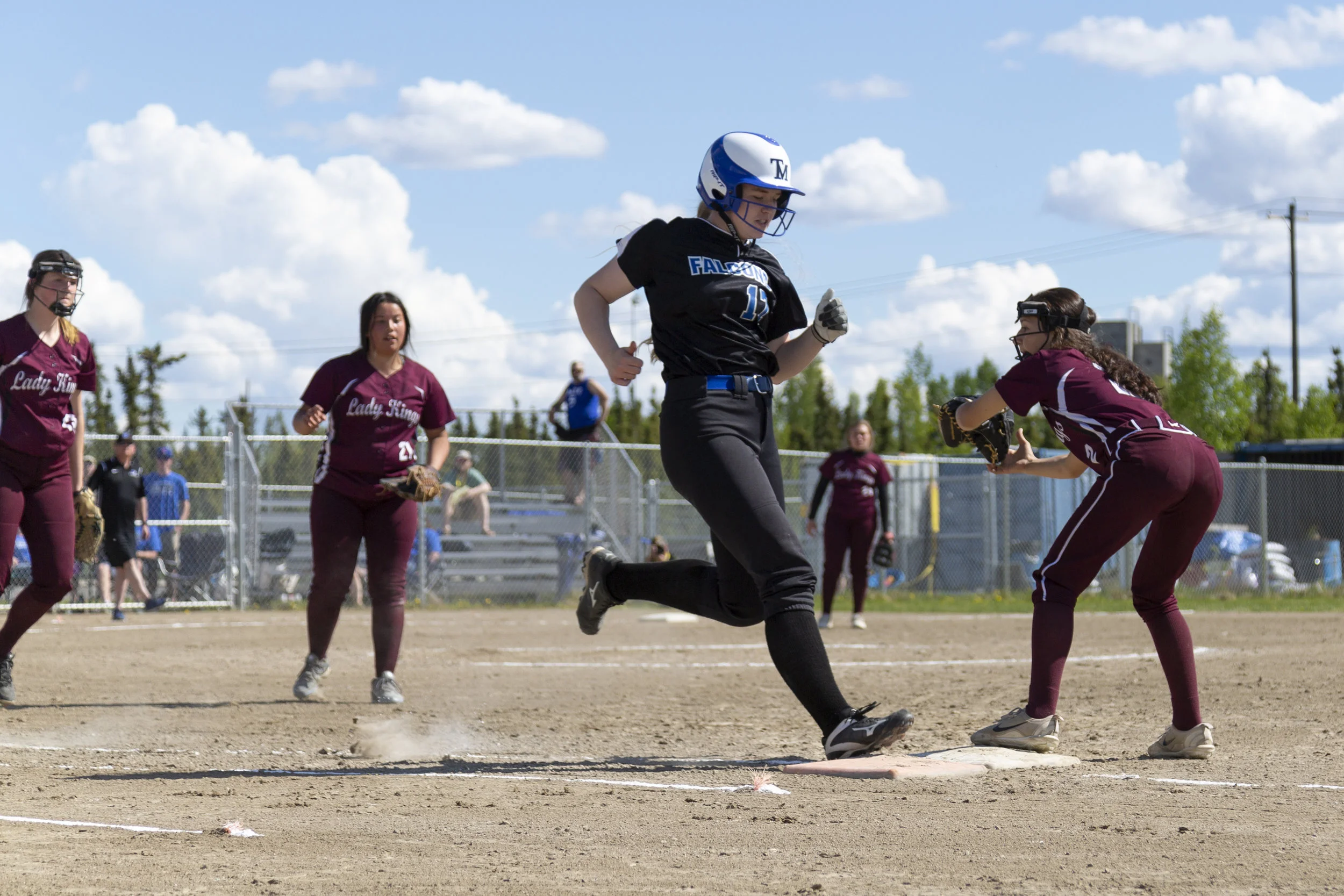 #30 Megan Dallas of Thunder Mountain High School makes it safely onto first base in the fourth inning of Thunder Mountain vs Ketchikan in the first Championship Game on Saturday, June 2nd in Fairbanks, AK. Sarah Manriquez/Juneau Empire