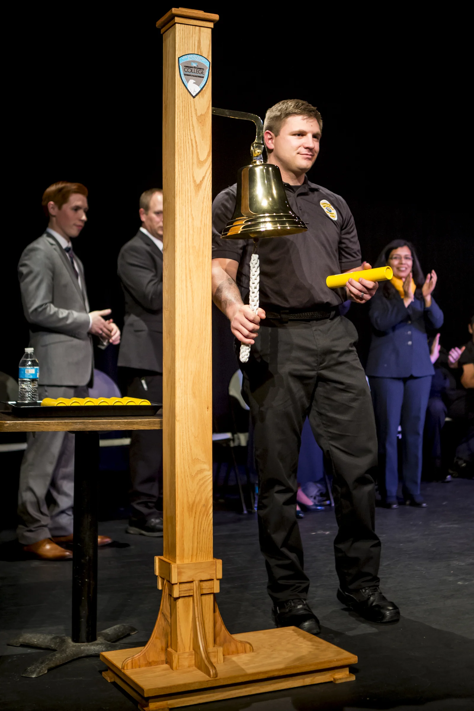 Anthony Thomas rings the bell after receiving his diploma at the Community and Technical College Police Academy graduation on Friday, October 12th, 2018.