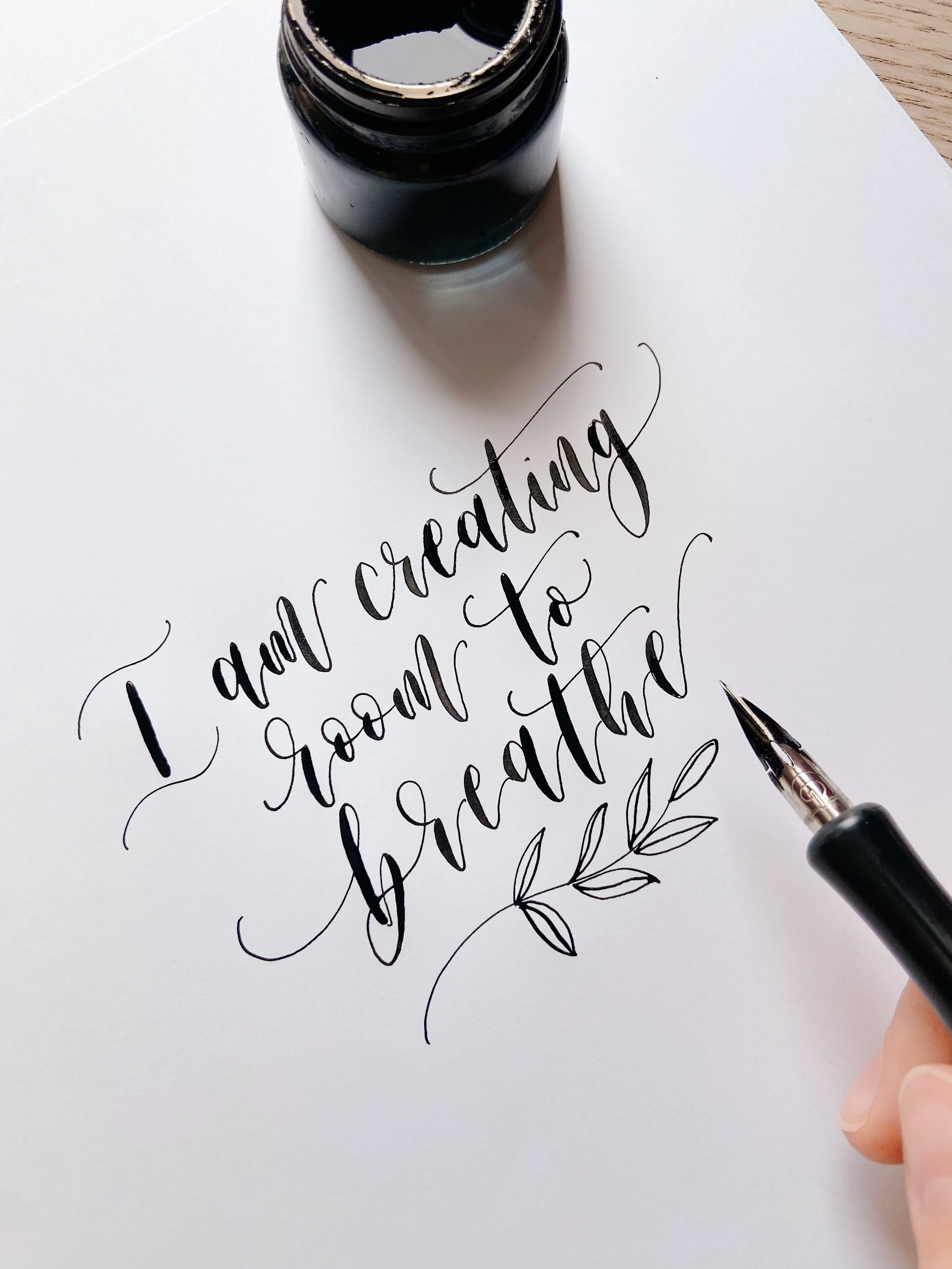 Mood boosting calligraphy quote