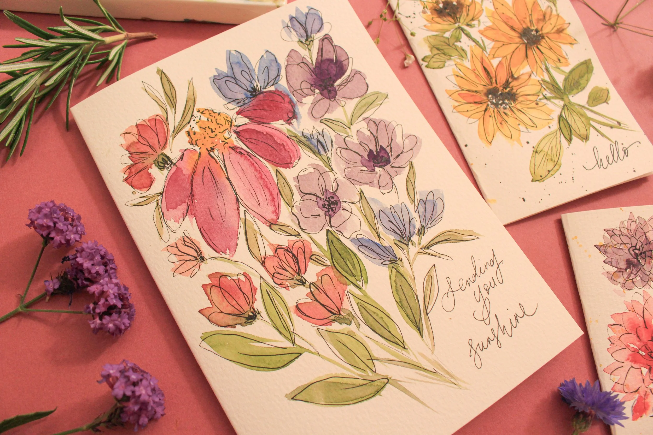 Loose botanical watercolour flowers with ink details and monoline lettering