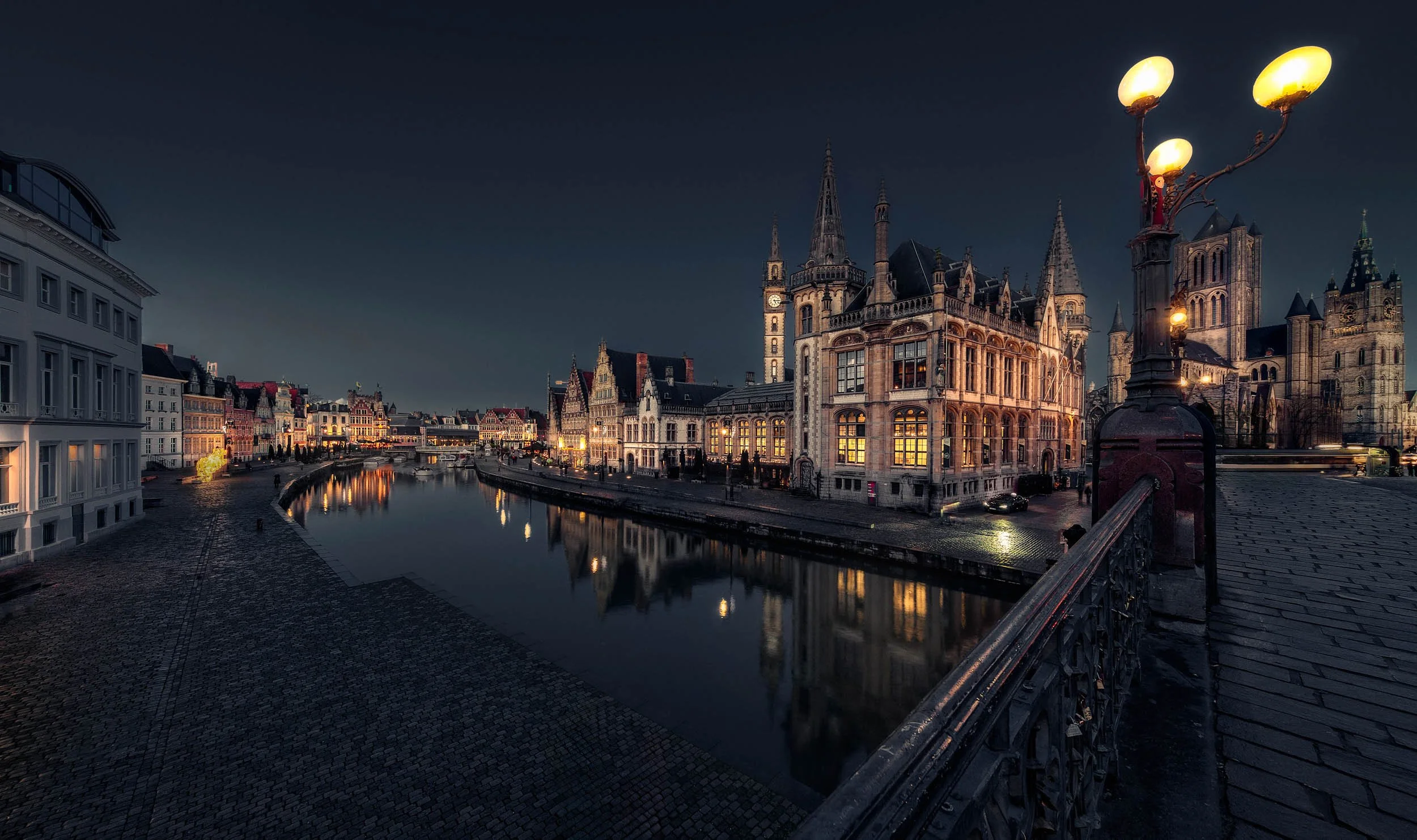 Wide angle cityscape image of Ghent during the blue hour.