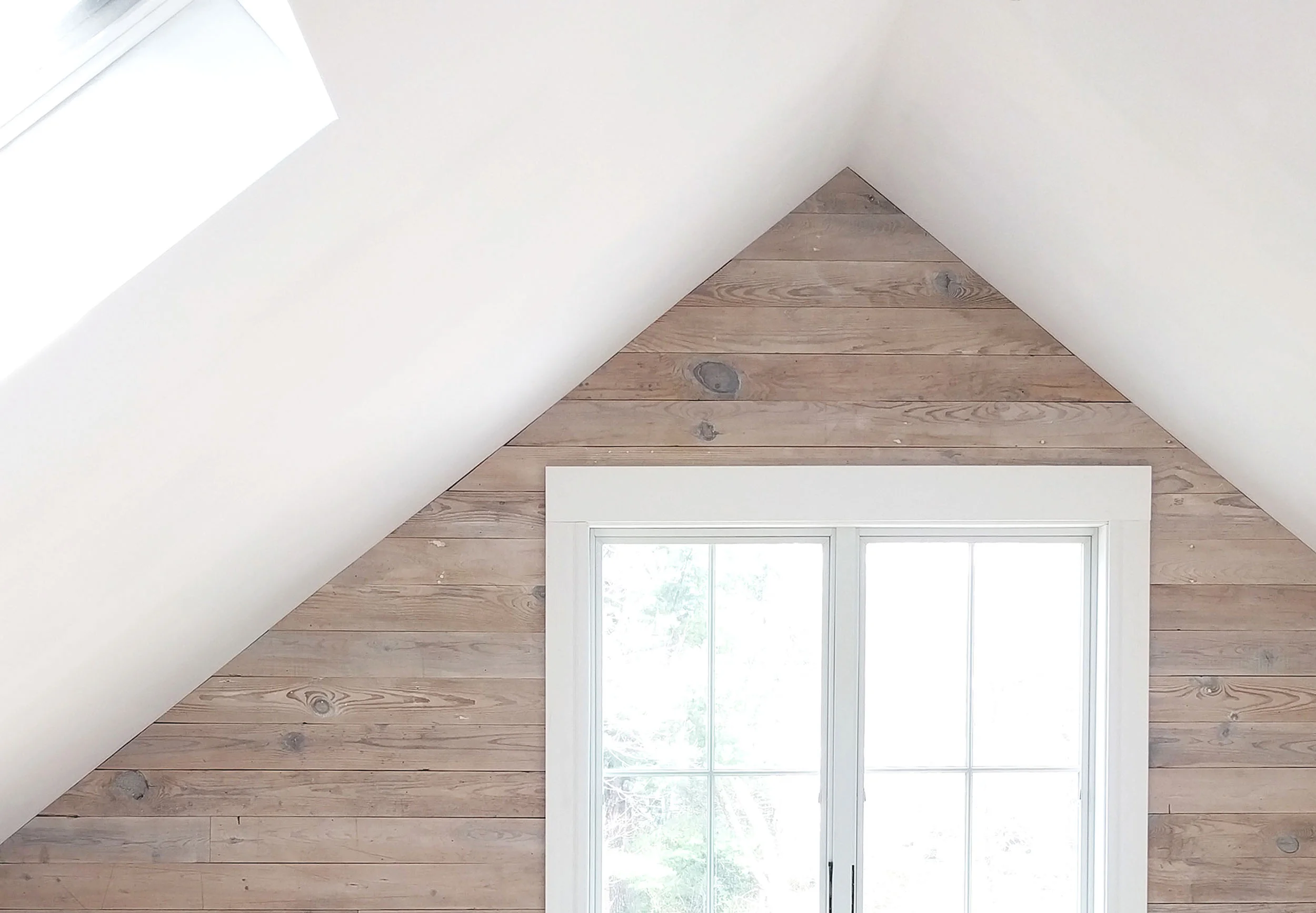 Reclaimed wood wall from original attic subfloor.