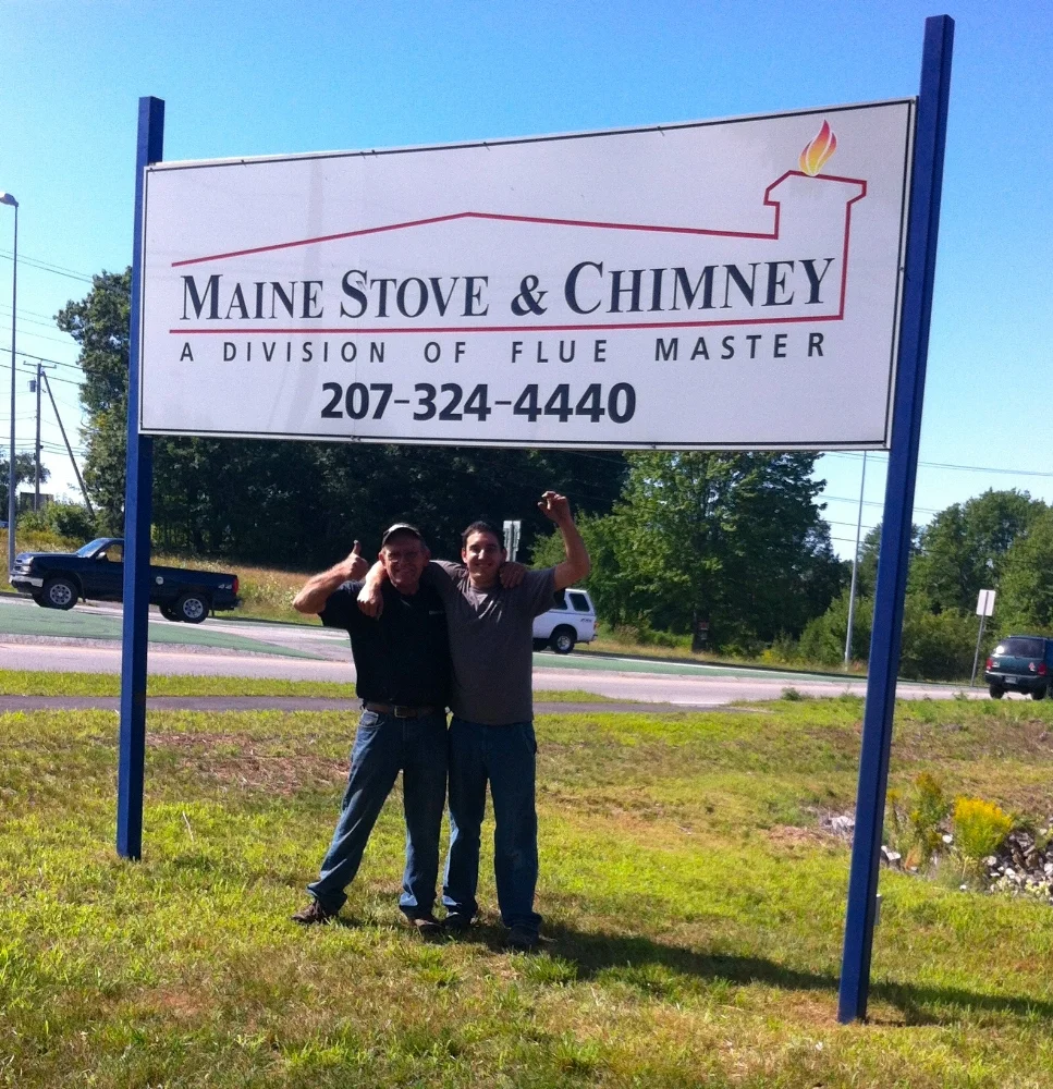 Doug &amp; JJ under the sign on opening day of our new Sanford location: 8/10/12