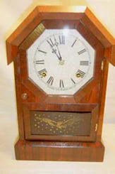 WATERBURY OCTAGON SHELF CLOCK. DATED: 1879