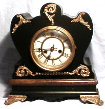 Waterbury mantle, ornate wood case clock, model