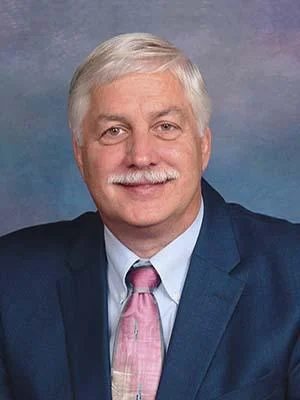 Headshot of Gerry Corrigan.