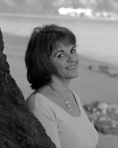 Head shot of Jan LaFontaine, from the shoulders up with an ocean in the background