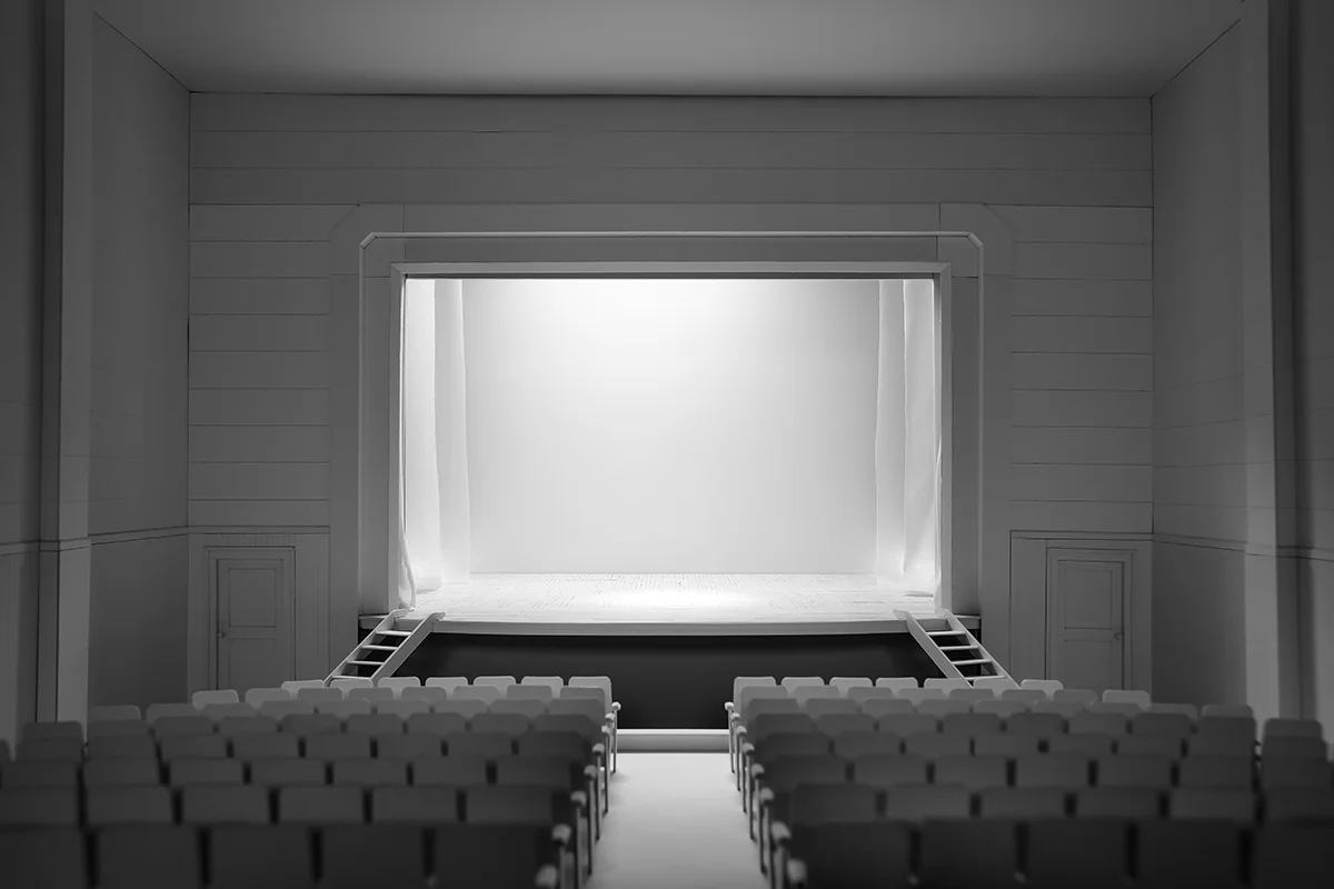 A small model that resembles an empty theater, facing the stage.