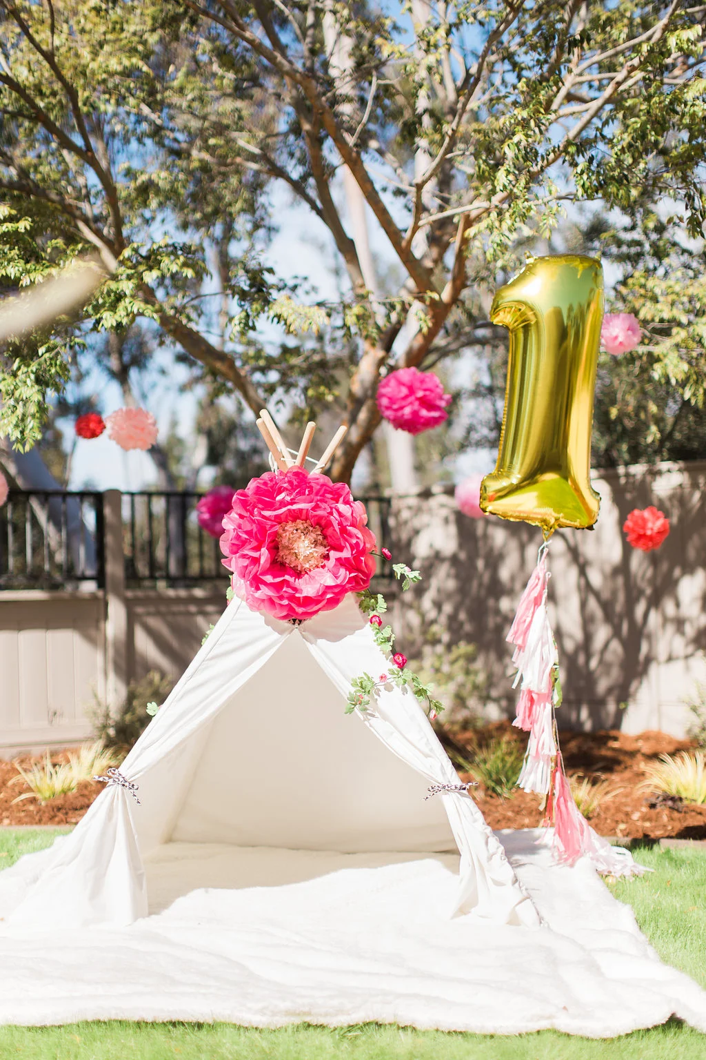 A bright and cheery teepee became the party photo booth and hangout spot. 