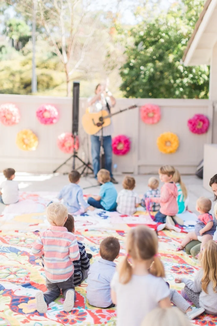 Little ones love music. Hiring someone to sing is always a great option, especially for a first birthday when some of the guests may be too young for other types of activities. Photo Courtesy of Amira Gray Photography.
