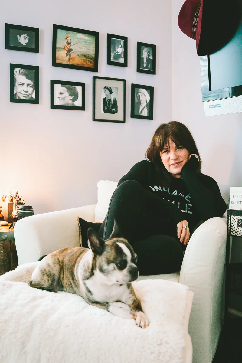 The photos behind her are of women who inspire her.