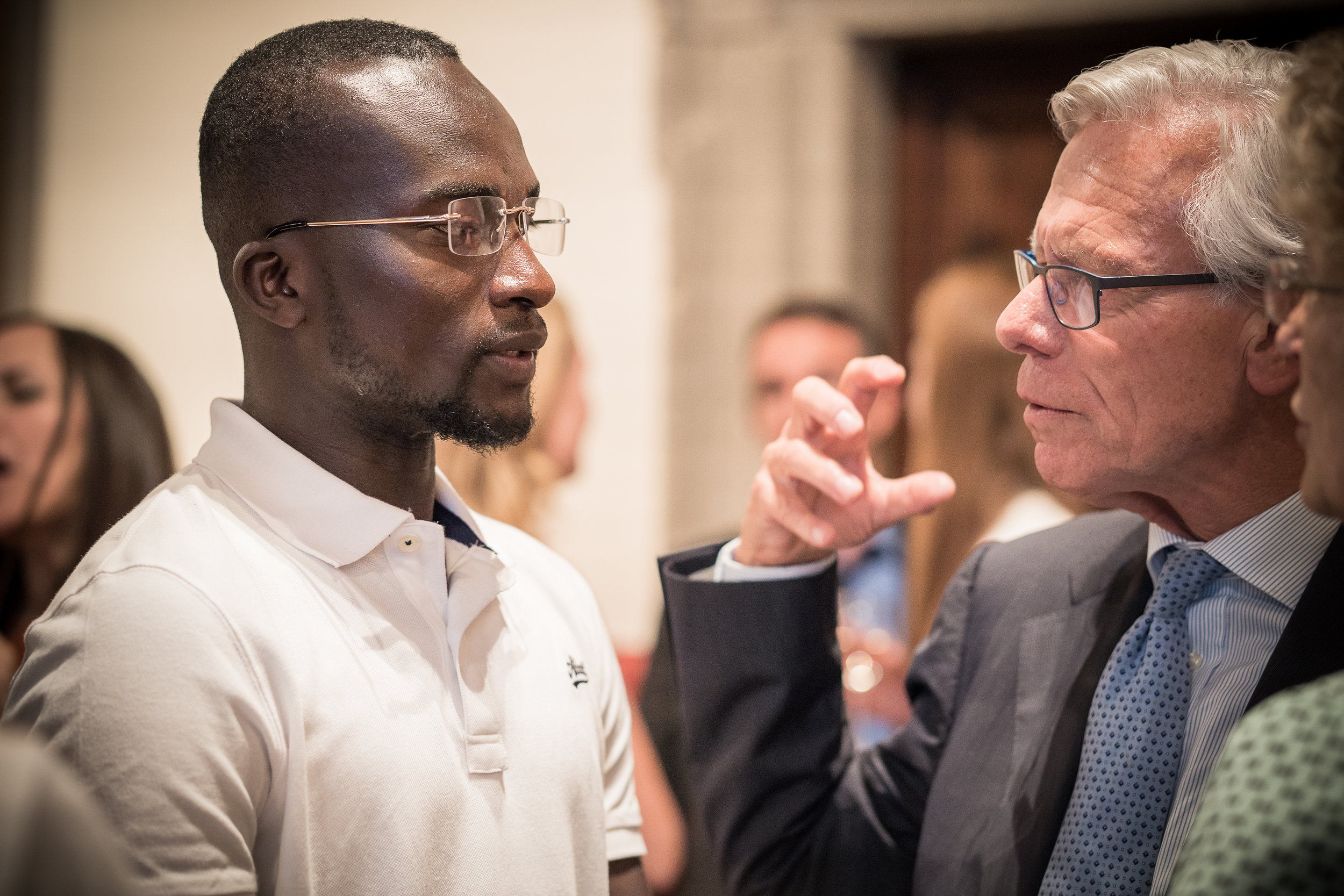  Bakary and Ambassador Knut Vollebaek, former Norwegian Foreign Minister talk at the Embassy of Switzerland, Rome. 11 June 2018. Image courtesy of  ICMP . 