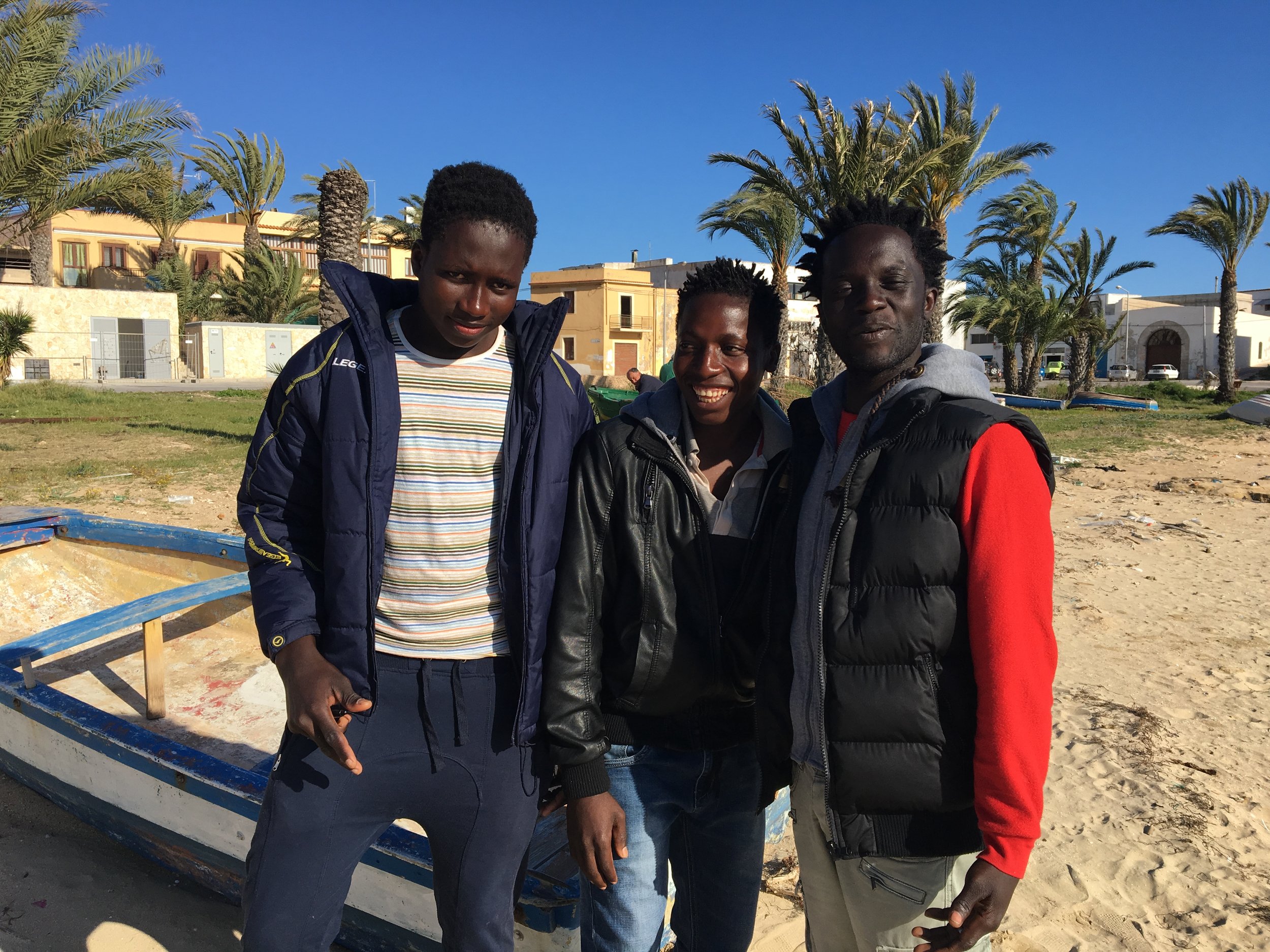   Ebrima and friends posing for the camera. Lampedusa, Italy; 3 April 2017. ©Pamela Kerpius  