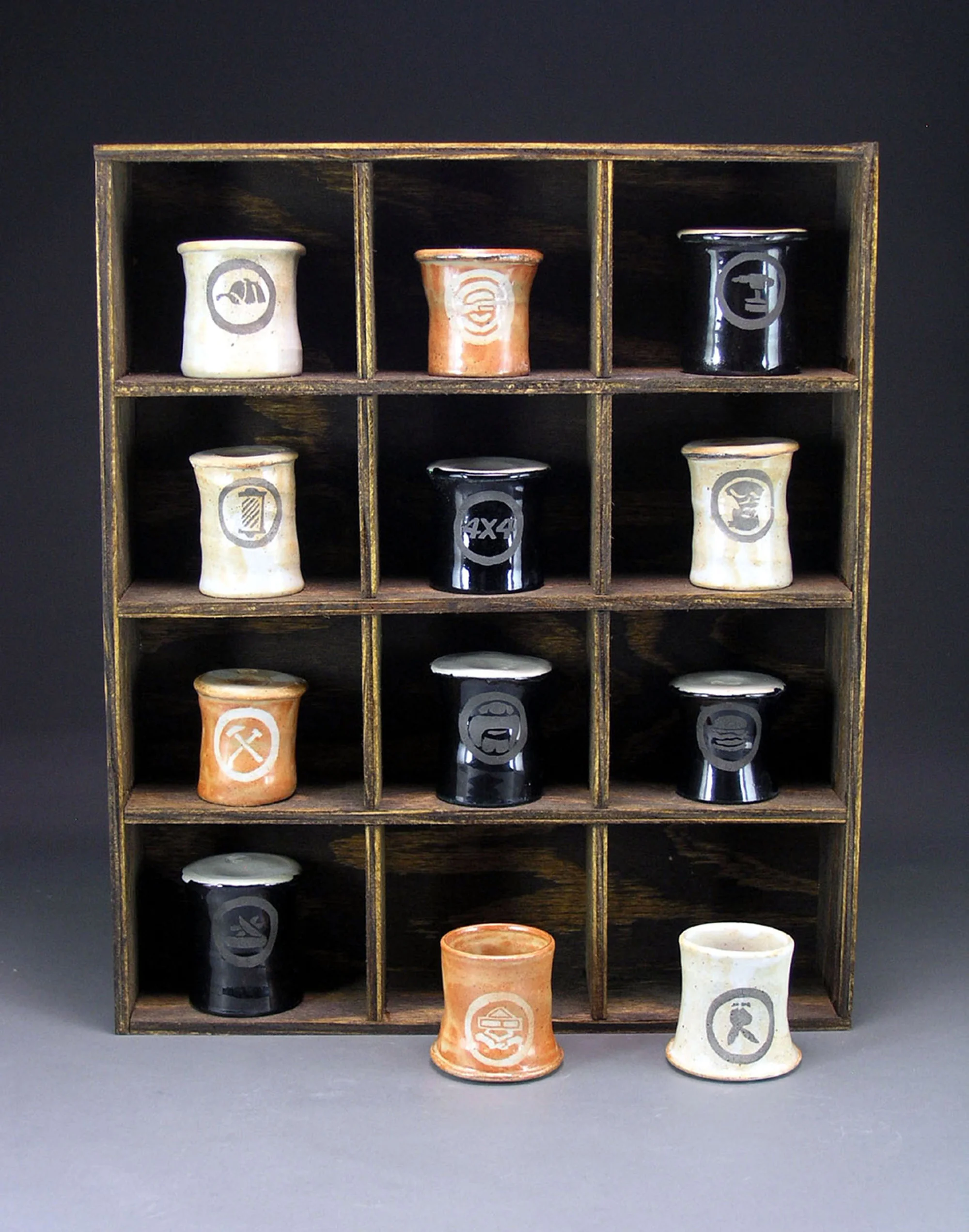 Frank_Tommy07_Ten Down, Two to Go_Stoneware, wood_12inx9inx2_2006.jpg