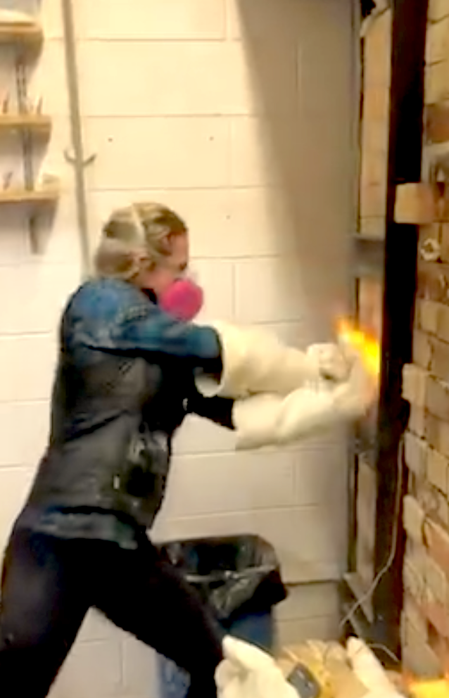 Sam Hostert - adding soda to kiln 1.png