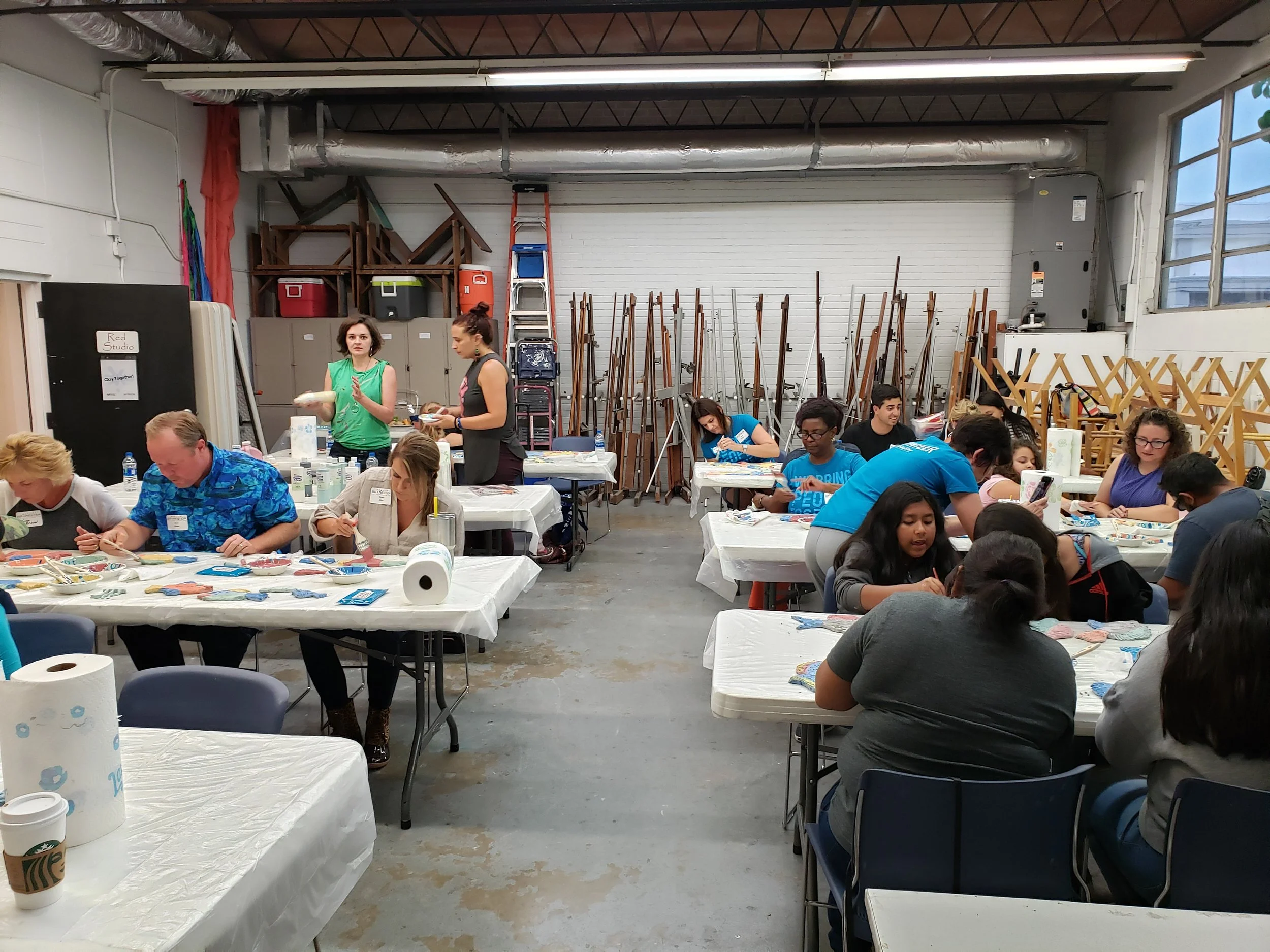 "Clay Together" workshop where the community makes some fish for the mosaic