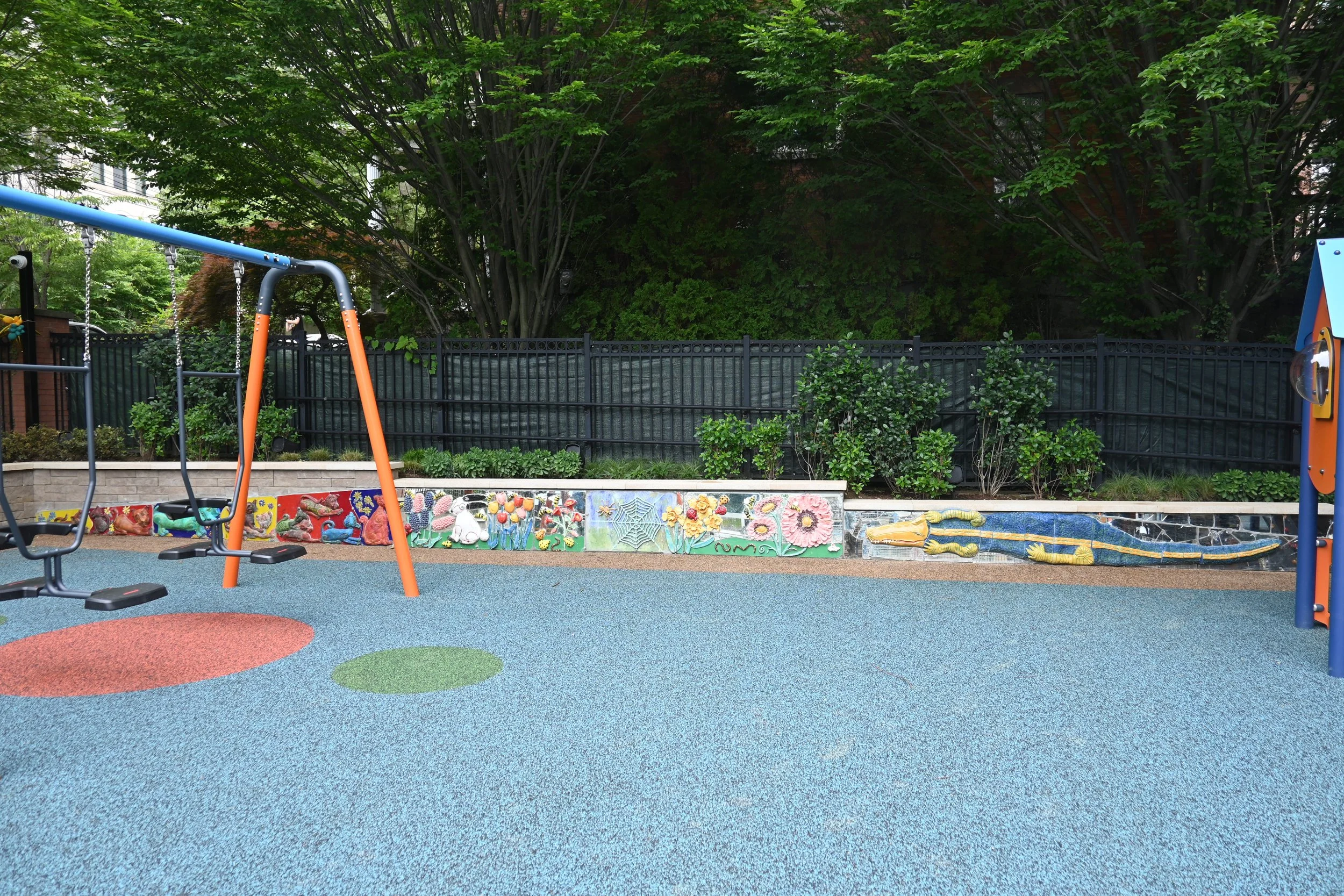  Full view of the relief sculpture wall along the back side of the new playground. 