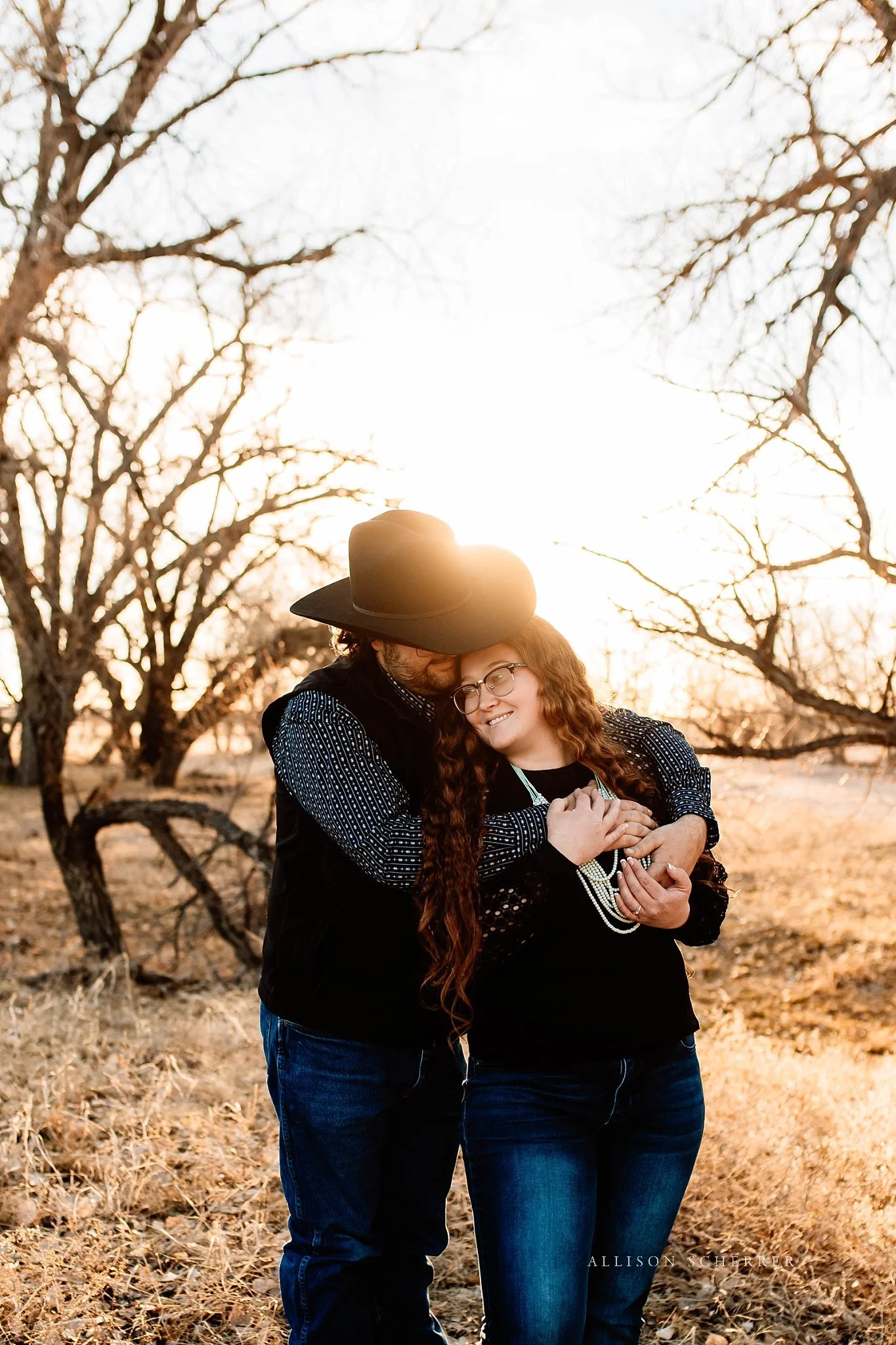 Alyssa and Michael engagement session with warm light in Limon CO