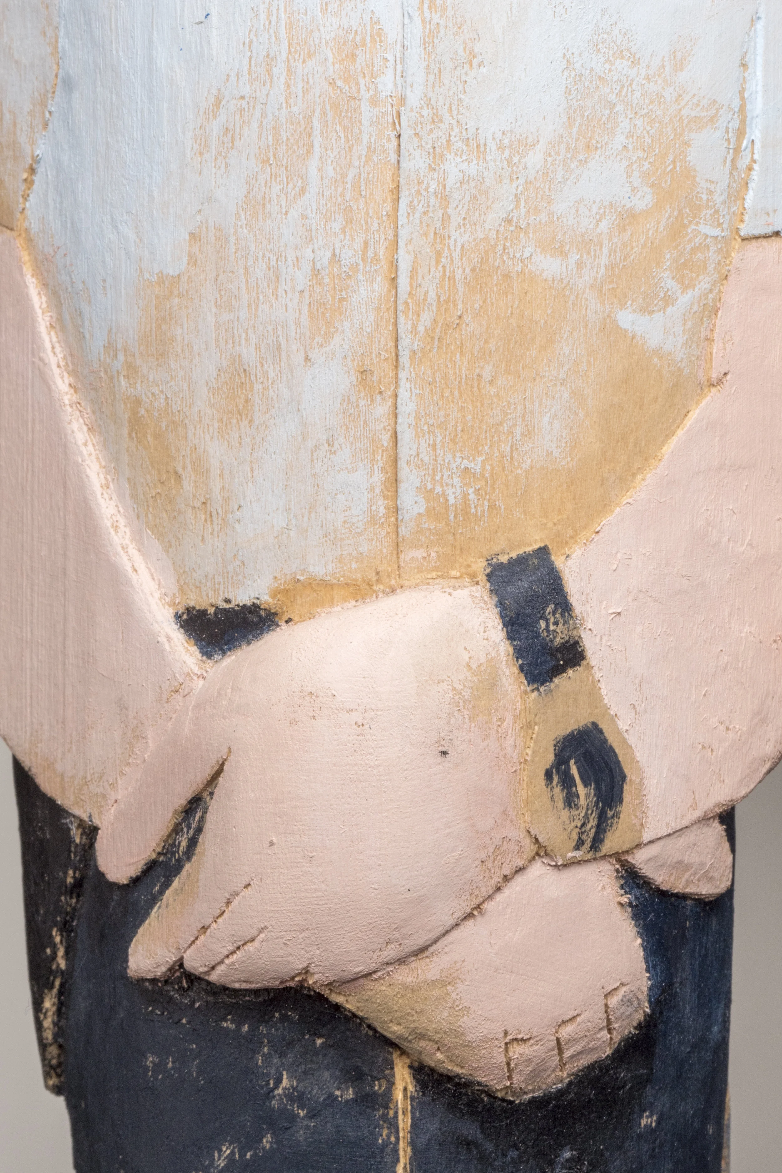 Gendarme sculpture closeup hands