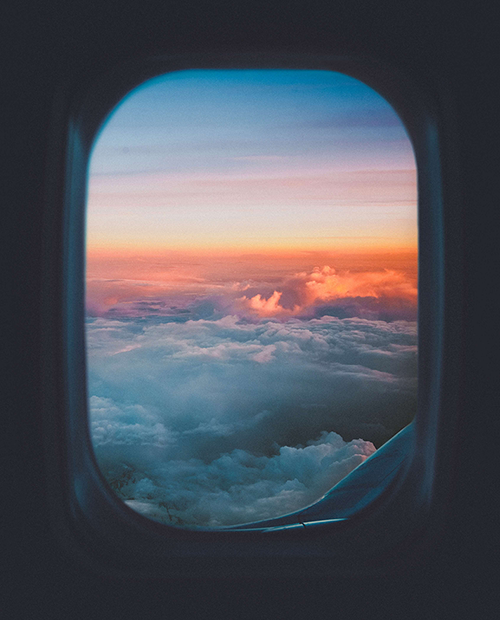 SM_clouds out airplane window.png