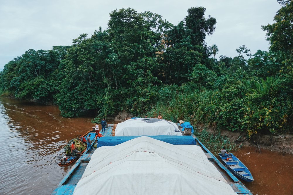  Throughout the journey the boat docks at isolated villages to pick-up and drop-off cargo, such as plantains. 