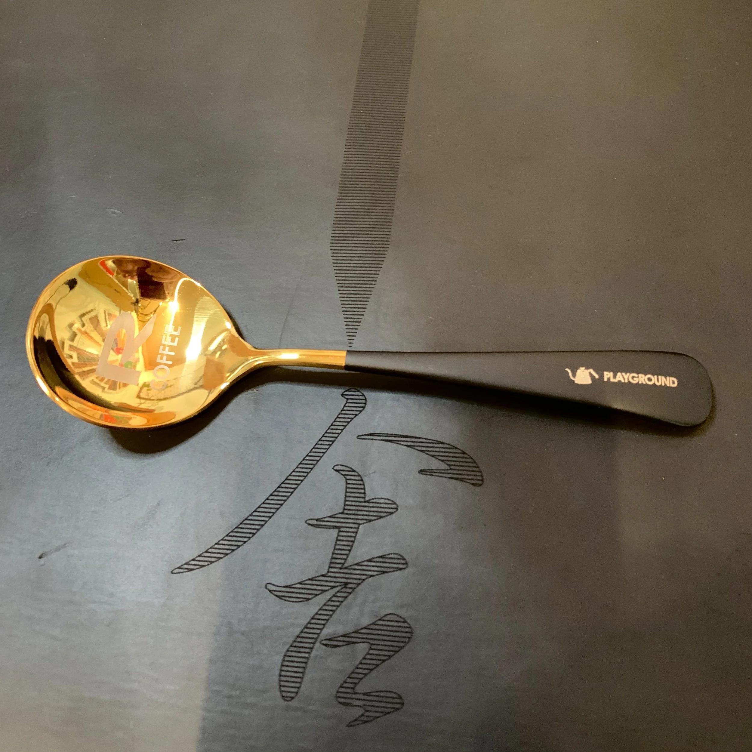 Two logos coffee cupping spoon.jpeg