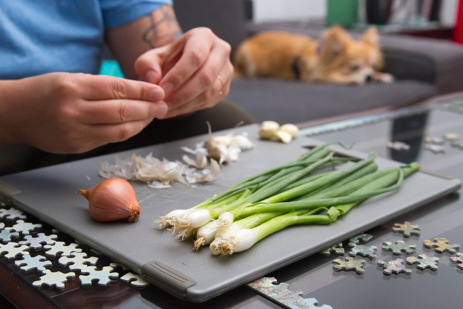 I love this image of my amazing multitasking wife prepping delish food atop her puzzle while watching the Olympics and being supervised by our grumpy chihuahua. 