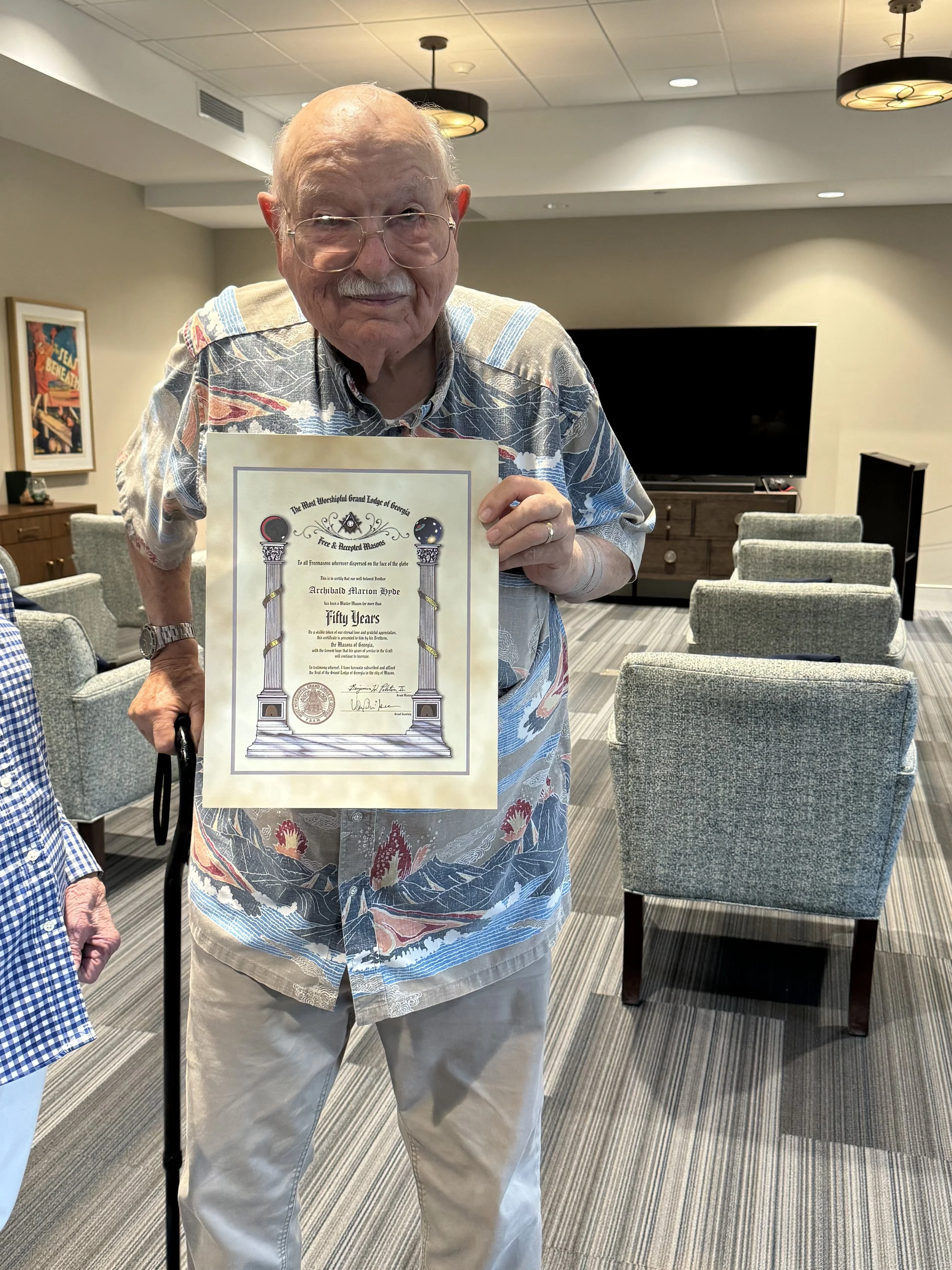 Bro. Archibald Hyde is presented with his  50-Year Award