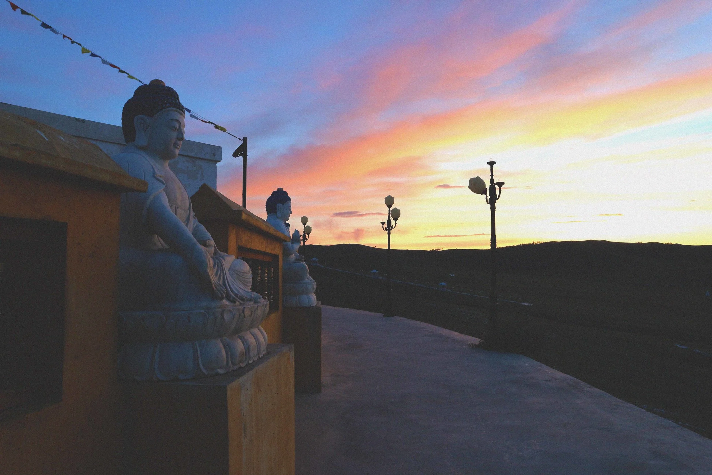 sunrise over the buddhist stupe and buddha at the amarbayasgalant monastery in mongolia beautiful mongolian sky