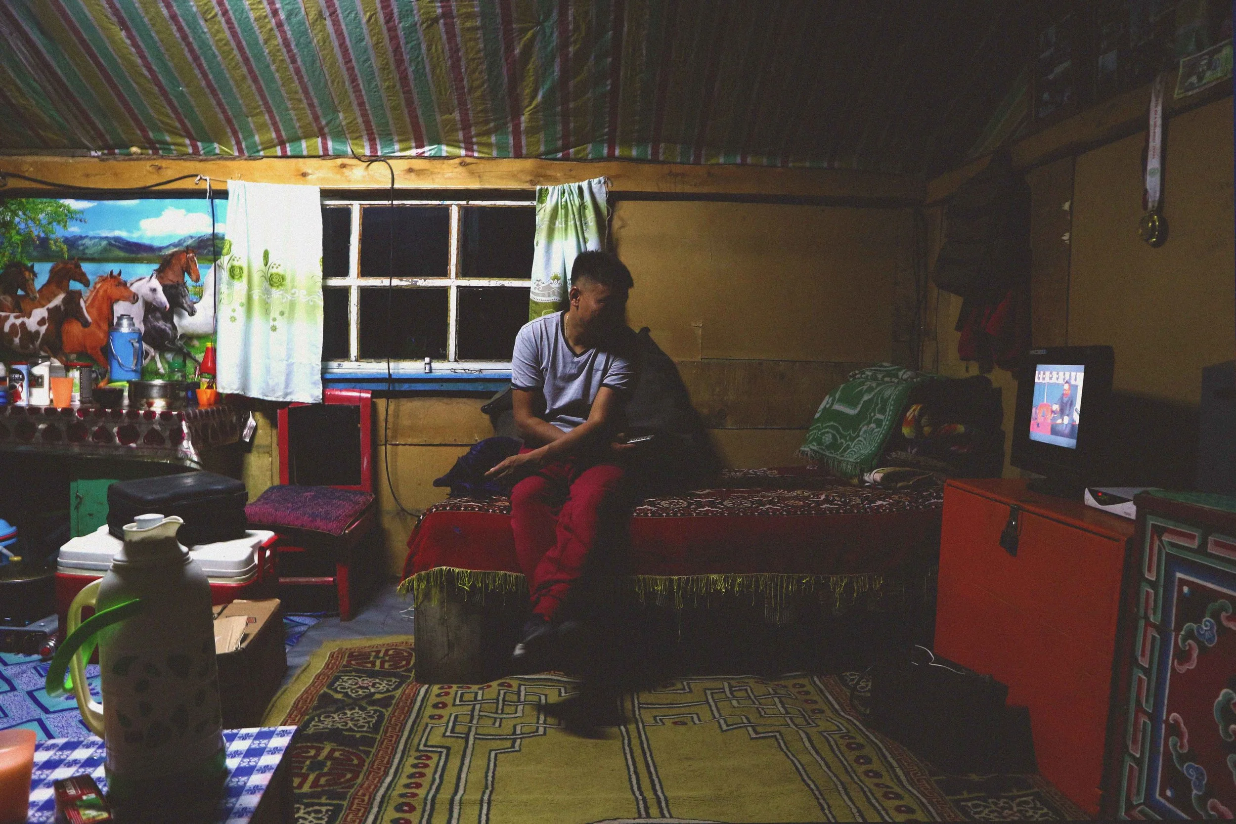 local mongolian man in his home in mongolia every day life