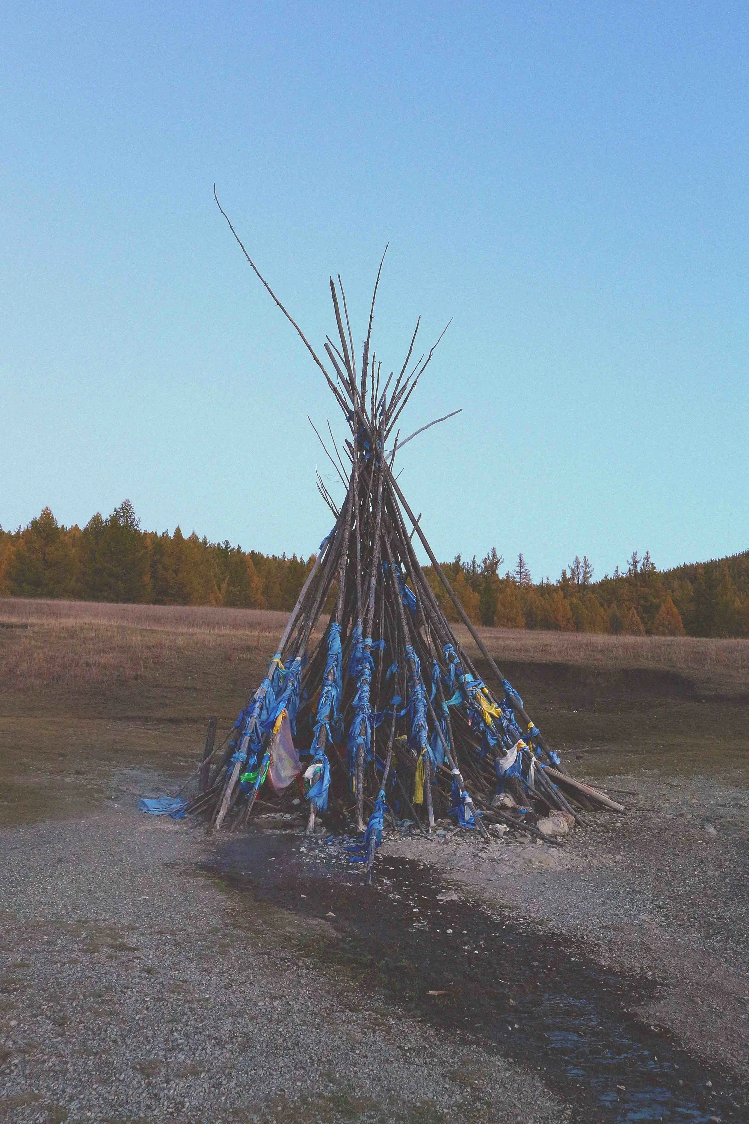 stupe wooden wood branches nature buddhism buddhist monument sacred in mongolia mongolian culture