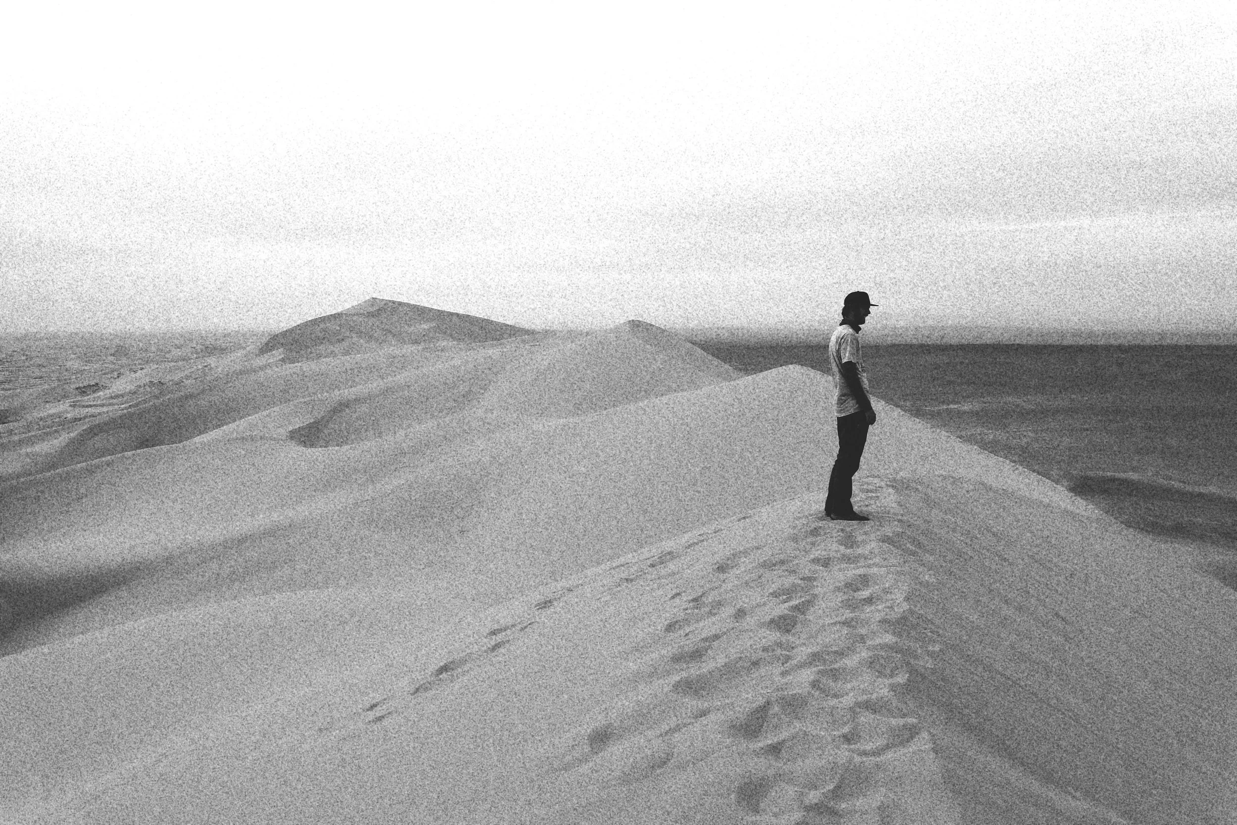 traveller in the khongor sand dunes, gobi desert, mongolian