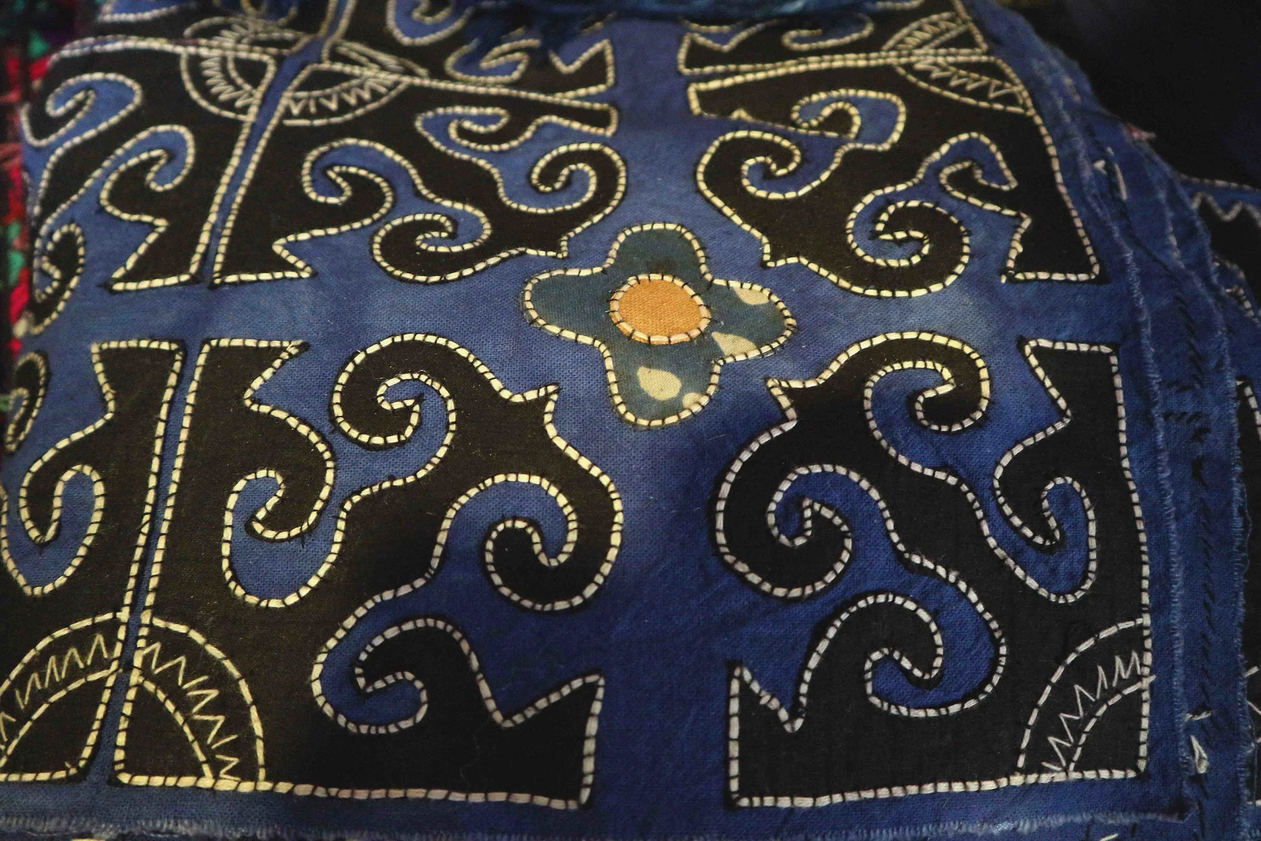 Cotton appliqué technique embroidery, made by the Yi minority. Cotton appliqué technique