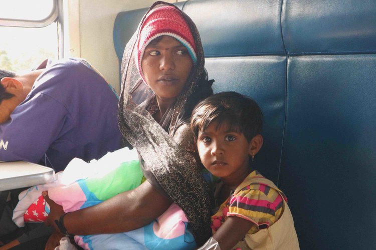 Locals on the train to Nuwara Eliya who shared their food with us