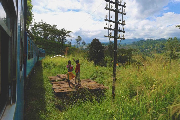 Local kids waving the train on by…