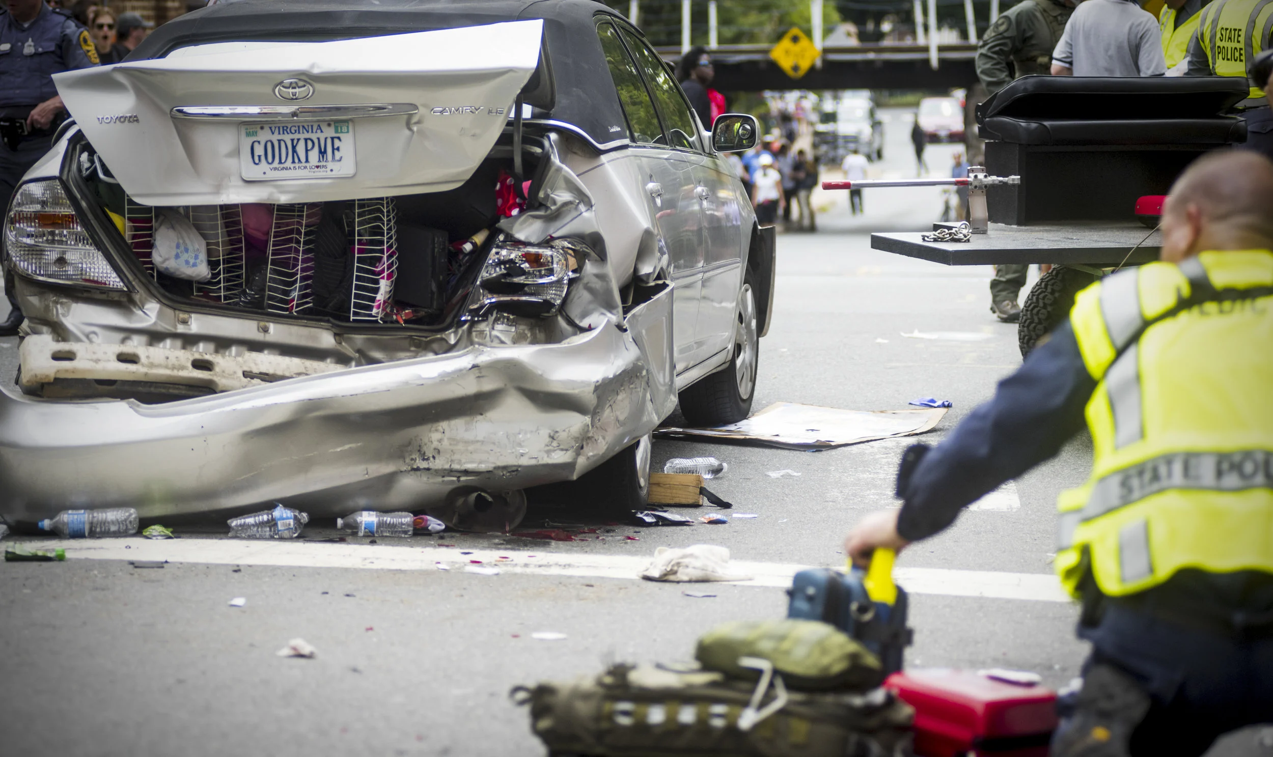  At the wreckage where Heather Heyer died, police sift through evidence 30 minutes after a car ran into a crowd of counter-protestors demonstrating after the "Unite the Right" rally. 