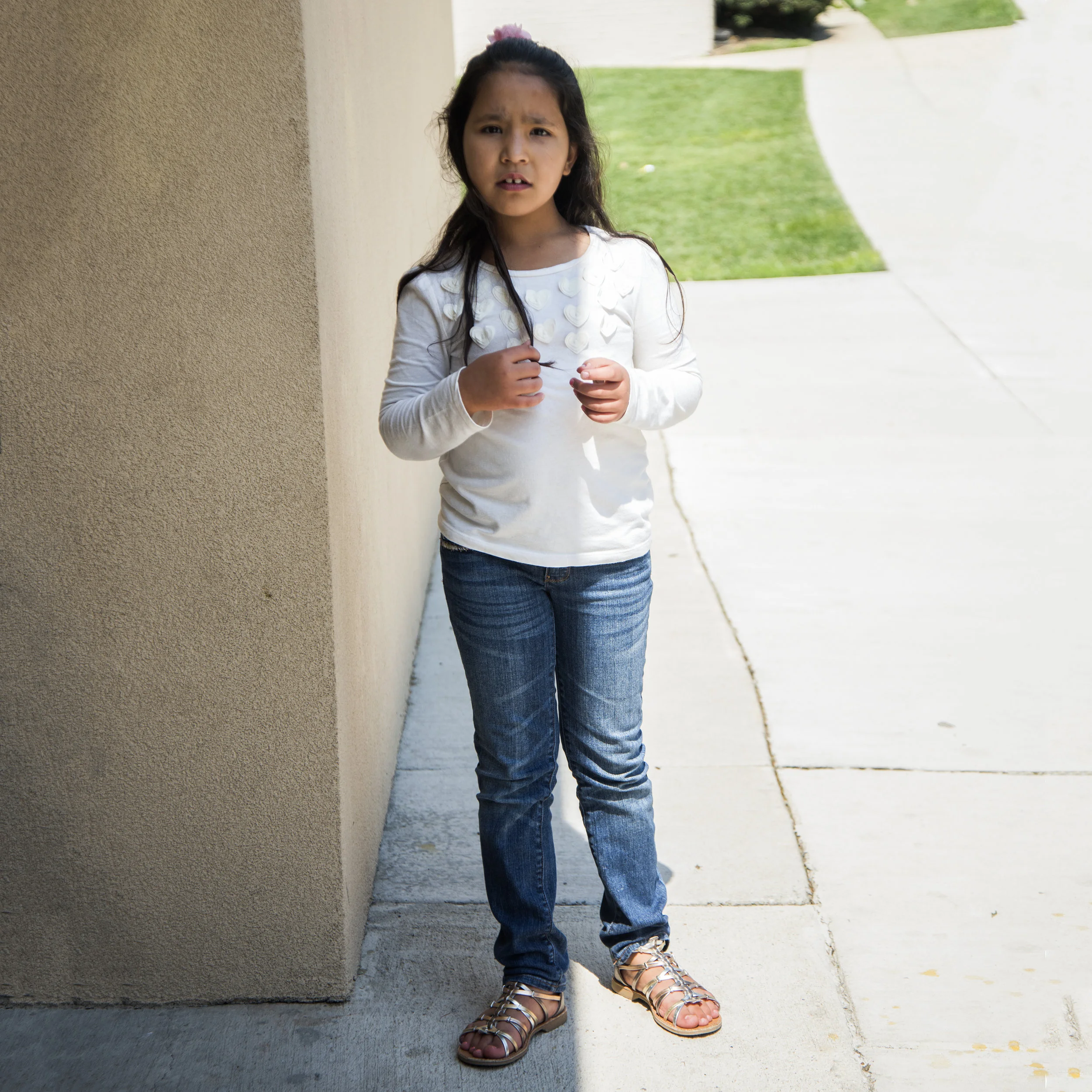 Yalda attends second grade, but cannot yet read the books her teachers assign her. She is steadily learning to speak, write, and read English better. 