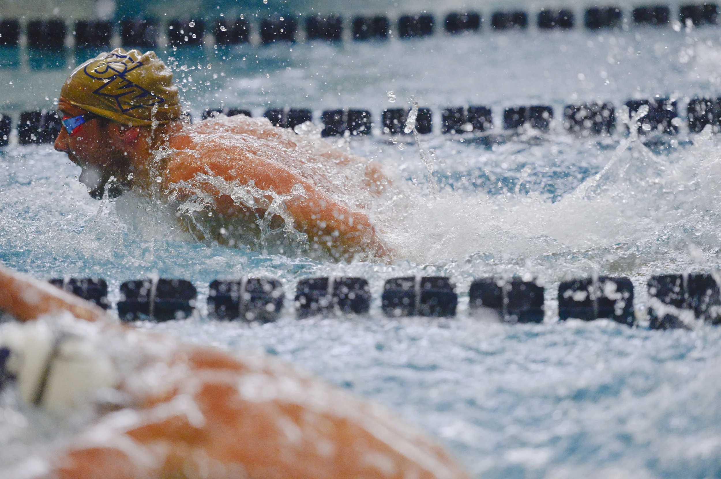  A George Washington student races during swimming and diving's first dual meet of the year at Howard on October 14, 2017. 