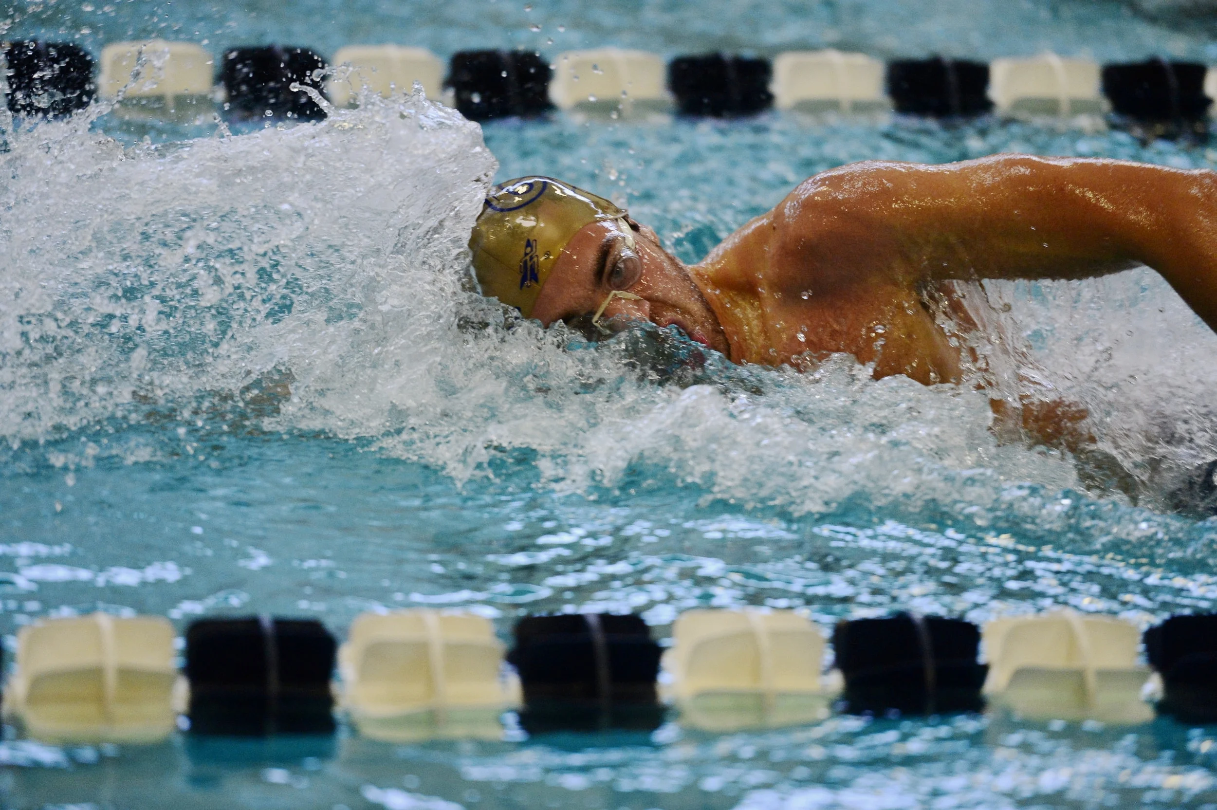  GWU freshman Nathaniel Hayward swims freestyle during a meet with Howard University on January 12, 2018. 